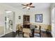 Cozy dining room with wainscoting, a ceiling fan, and space for a round table at 682 Leighton Way, Stone Mountain, GA 30088