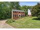 Beautiful two-story brick home with manicured lawn and landscaping in a quiet neighborhood at 682 Leighton Way, Stone Mountain, GA 30088