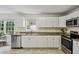 Bright kitchen with stainless steel appliances and granite countertops at 682 Leighton Way, Stone Mountain, GA 30088
