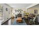 Bright living room with large windows, hardwood floors, and comfortable seating arrangement at 682 Leighton Way, Stone Mountain, GA 30088