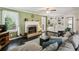 Cozy living room with fireplace, built-in shelves, and comfortable seating at 682 Leighton Way, Stone Mountain, GA 30088