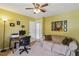 Comfortable office space with a desk, couch, and playful artwork at 682 Leighton Way, Stone Mountain, GA 30088