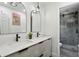 Updated bathroom boasts a double vanity, modern fixtures, and a beautifully tiled shower at 321 Hickory Sw Walk, Marietta, GA 30064