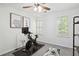Bright bedroom features a ceiling fan, neutral walls, carpet, and light-filled windows with plantation shutters at 321 Hickory Sw Walk, Marietta, GA 30064