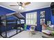Blue bedroom features a bunk bed, desk, neutral carpet, white trim, and a window with plantation shutters at 321 Hickory Sw Walk, Marietta, GA 30064