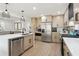 Well-lit kitchen features stainless steel appliances, modern countertops, and ample cabinet space at 321 Hickory Sw Walk, Marietta, GA 30064