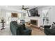 Bright living room features a fireplace, hardwood floors, comfortable furniture, and lots of natural light at 321 Hickory Sw Walk, Marietta, GA 30064