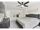 Comfortable main bedroom with a large bed, accent decor, and ample closet space at 321 Hickory Sw Walk, Marietta, GA 30064