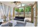Inviting sunroom with ample seating, natural light, and serene backyard views at 321 Hickory Sw Walk, Marietta, GA 30064