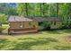 The house has a spacious backyard and a wooden deck, perfect for outdoor activities and relaxation at 2740 Pasco Se Ln, Atlanta, GA 30316