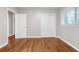 Spacious bedroom with hardwood floors, closet, and natural light streaming through the window at 2740 Pasco Se Ln, Atlanta, GA 30316