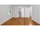 Spacious bedroom with hardwood floors, closet, and natural light streaming through the window at 2740 Pasco Se Ln, Atlanta, GA 30316