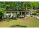 Quaint single-story home with a well-maintained lawn and mature trees creating a serene setting at 2740 Pasco Se Ln, Atlanta, GA 30316