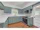 Modern kitchen with new stainless steel appliances, quartz counters, and new shaker cabinets at 2740 Pasco Se Ln, Atlanta, GA 30316
