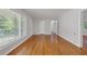 Spacious living room with hardwood floors, large window, and neutral paint ready for personal touches at 2740 Pasco Se Ln, Atlanta, GA 30316