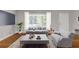 Bright living room features a comfortable couch, natural light, and stylish decor at 2740 Pasco Se Ln, Atlanta, GA 30316