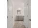 Bathroom view featuring a vanity with gray cabinets and tile floor at 460 Reflection Dr # 21, Stockbridge, GA 30281
