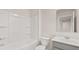 A well-lit bathroom with a tub-shower, a toilet, and a vanity with a mirror at 460 Reflection Dr # 21, Stockbridge, GA 30281