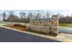 Stone entrance sign for Echo Glen featuring manicured landscaping and a well-maintained surrounding area at 460 Reflection Dr # 21, Stockbridge, GA 30281