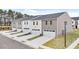Newly constructed townhomes with garages and manicured front lawns at 460 Reflection Dr # 21, Stockbridge, GA 30281
