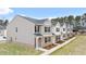 Charming row of two-story townhomes featuring neutral siding, brick accents and black shutters at 460 Reflection Dr # 21, Stockbridge, GA 30281