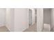 Neutral hallway with multiple doorways, providing access to different rooms at 460 Reflection Dr # 21, Stockbridge, GA 30281