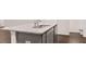 Kitchen island features a double sink and stainless steel dishwasher at 460 Reflection Dr # 21, Stockbridge, GA 30281