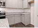 This kitchen features granite countertops, stainless steel appliances and gray cabinets at 460 Reflection Dr # 21, Stockbridge, GA 30281
