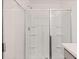 Bright and clean shower with sliding glass doors and built-in shelving at 460 Reflection Dr # 21, Stockbridge, GA 30281
