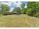 The residence features a spacious backyard, partially shaded by mature trees, perfect for relaxing and recreation at 2944 Williams Pl, Snellville, GA 30078