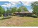 A generous backyard displays a screened-in porch, with space for a trampoline and hammock at 2944 Williams Pl, Snellville, GA 30078