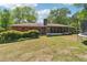 A sprawling backyard showcases a screened-in porch, providing an ideal spot for outdoor entertaining at 2944 Williams Pl, Snellville, GA 30078