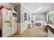 Cozy kitchen area with a bright eating nook, a refrigerator, and access to the side yard at 2944 Williams Pl, Snellville, GA 30078