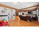 Open living space with hardwood floors, exposed beams, and a view of the kitchen at 2944 Williams Pl, Snellville, GA 30078