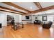 Large living room with hardwood floors and modern ceiling beams at 2944 Williams Pl, Snellville, GA 30078
