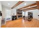 Open concept living space with wood floors and a brick fireplace at 2944 Williams Pl, Snellville, GA 30078