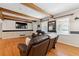 Cozy living room showcasing hardwood floors, a large TV, and inviting seating at 2944 Williams Pl, Snellville, GA 30078