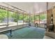 Sun room with exercise equipment and a brick accent wall at 2944 Williams Pl, Snellville, GA 30078
