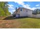 Backyard with lush green grass and white fence surrounds the property at 4499 Bellemeade Dr, Douglasville, GA 30135