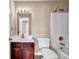 Traditional bathroom featuring a tub shower and a dark wood vanity with a white sink at 4499 Bellemeade Dr, Douglasville, GA 30135