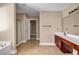 Bathroom with double sink vanity, tile floor, and glass enclosed shower at 4499 Bellemeade Dr, Douglasville, GA 30135