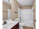 Bathroom featuring a shower-tub combo, single sink, and a tile floor at 4499 Bellemeade Dr, Douglasville, GA 30135