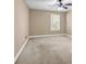 Bedroom featuring neutral carpet, beige walls, and a window with blinds at 4499 Bellemeade Dr, Douglasville, GA 30135
