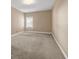 A bedroom featuring neutral carpet, neutral walls, and natural light from a window at 4499 Bellemeade Dr, Douglasville, GA 30135