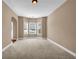 Carpeted bonus room with bay window provides plenty of natural light and space at 4499 Bellemeade Dr, Douglasville, GA 30135