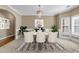 Elegant dining room features wainscoting, chandelier, and large windows at 4499 Bellemeade Dr, Douglasville, GA 30135