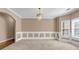 Bright dining room with wainscoting, a chandelier, and lots of natural light at 4499 Bellemeade Dr, Douglasville, GA 30135