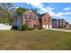 Charming two-story brick home with three-car garage and a large, well-maintained lawn at 4499 Bellemeade Dr, Douglasville, GA 30135