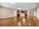 Open-concept living space with wood flooring connecting the kitchen and dining area, creating an inviting atmosphere at 4499 Bellemeade Dr, Douglasville, GA 30135