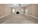 Spacious living room with a fireplace, neutral walls, carpet flooring, and natural light at 4499 Bellemeade Dr, Douglasville, GA 30135